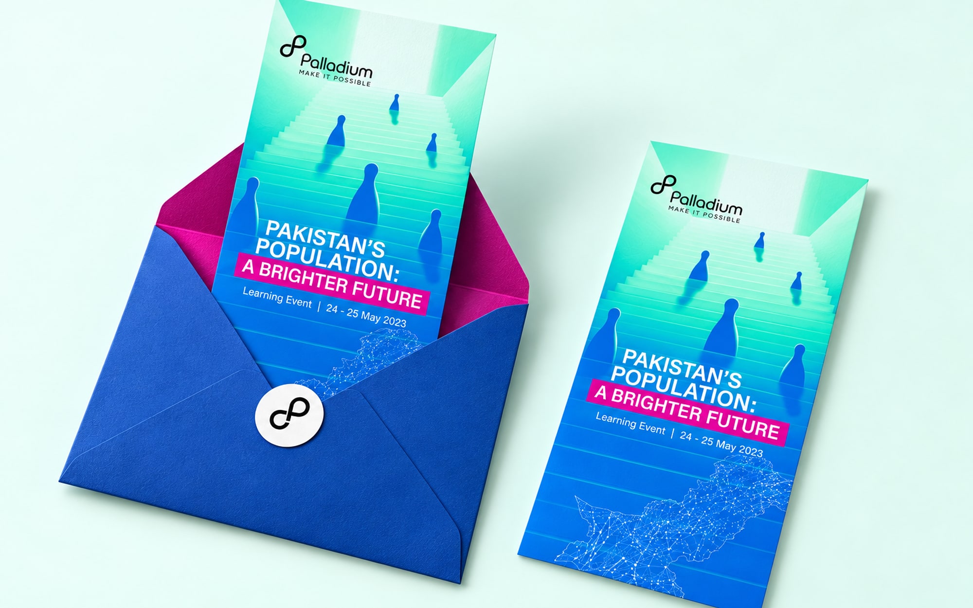 A tall invitation card printed with the vertical key visual, half out of a royal blue envelope with a magenta lining