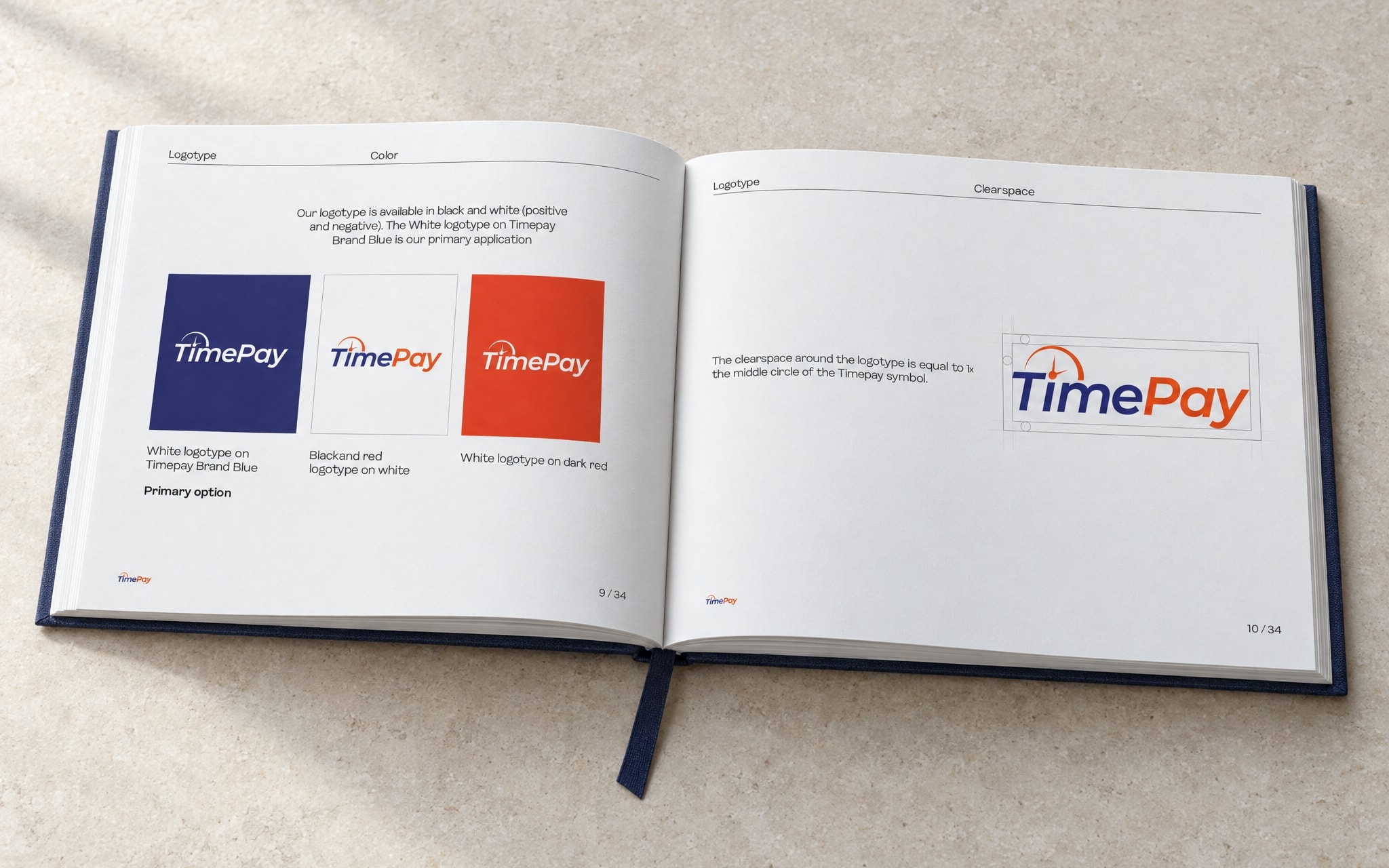 The book open at the colour variants and clearspace spread: the mark on navy, white and red on the left, the clearspace diagram on the right
