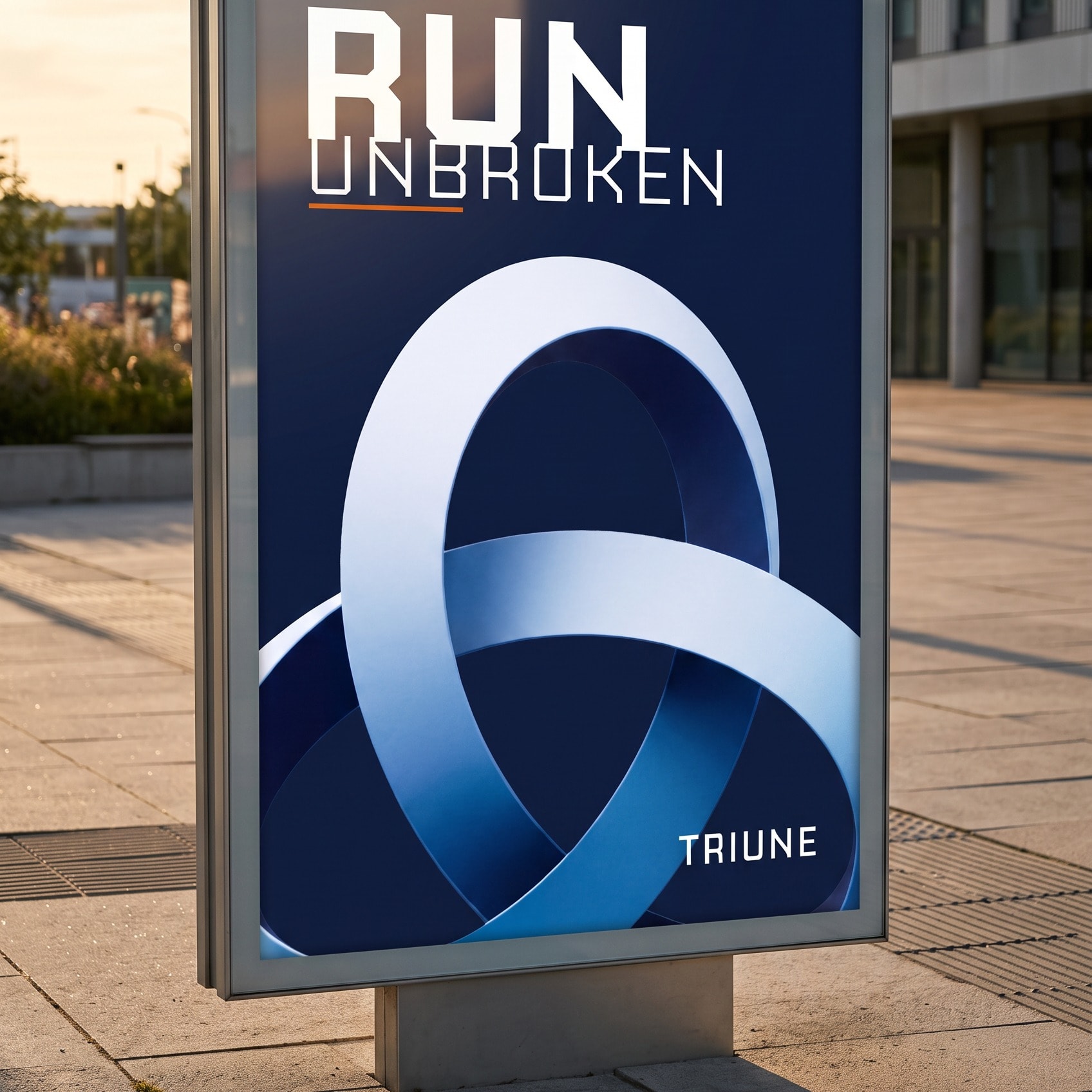 A backlit street poster in a slim aluminium case at dusk: RUN over UNBROKEN at the head, the mark cropped large below, the wordmark at the foot