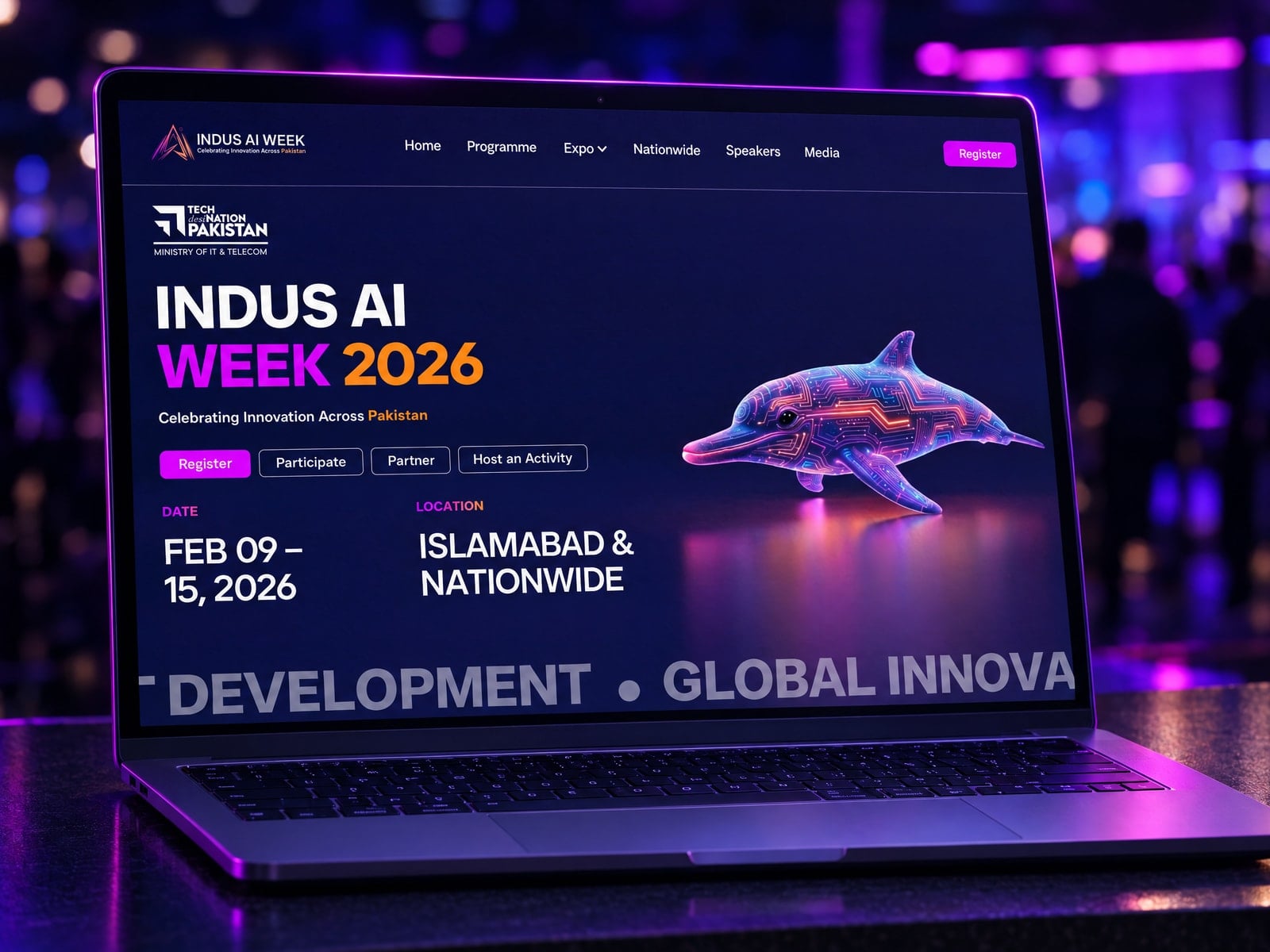 The Indus AI Week homepage on a laptop at a technology summit