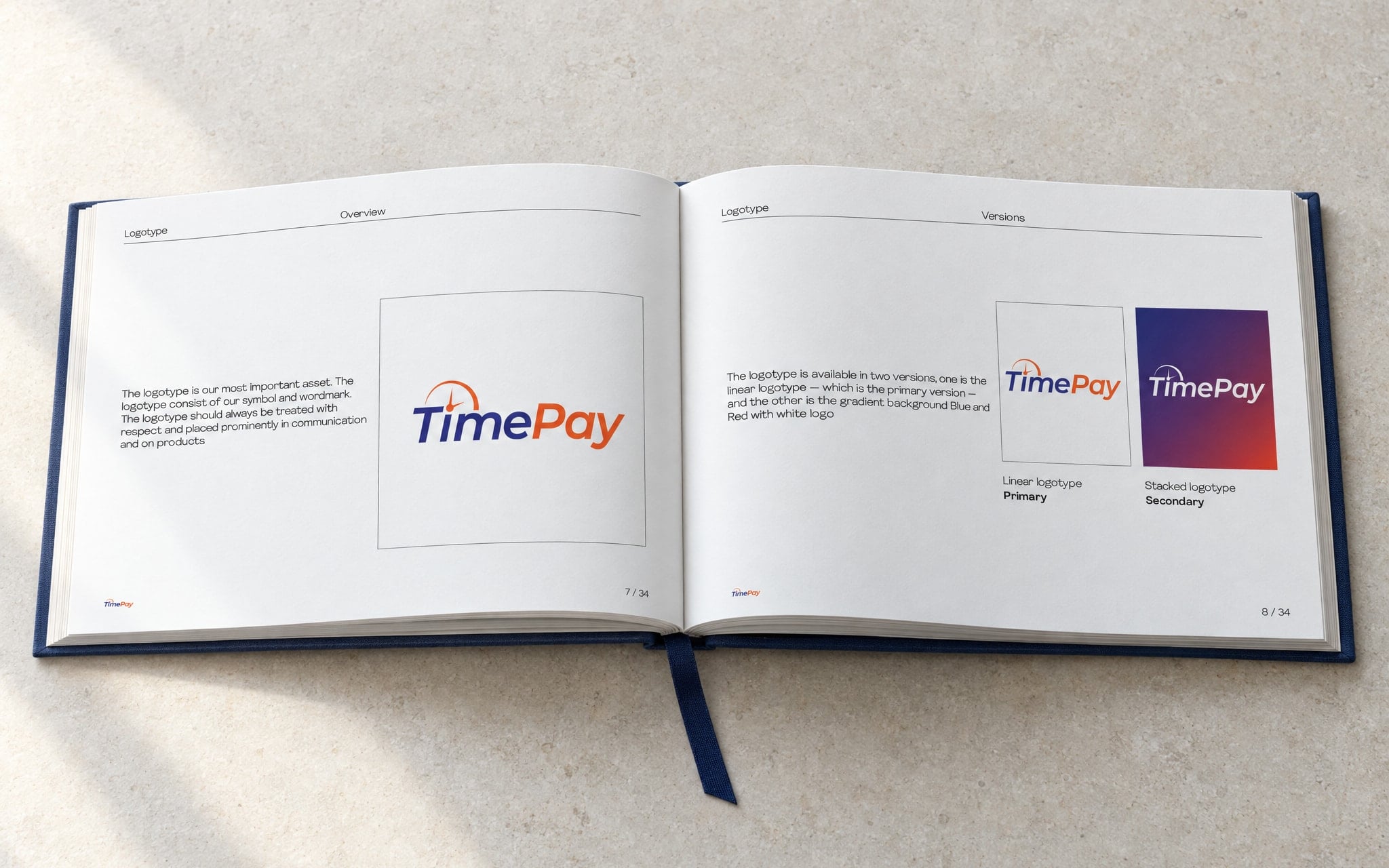The brand guidelines book open at the logotype spread: the primary mark on the left page, the linear and stacked lockups on the right