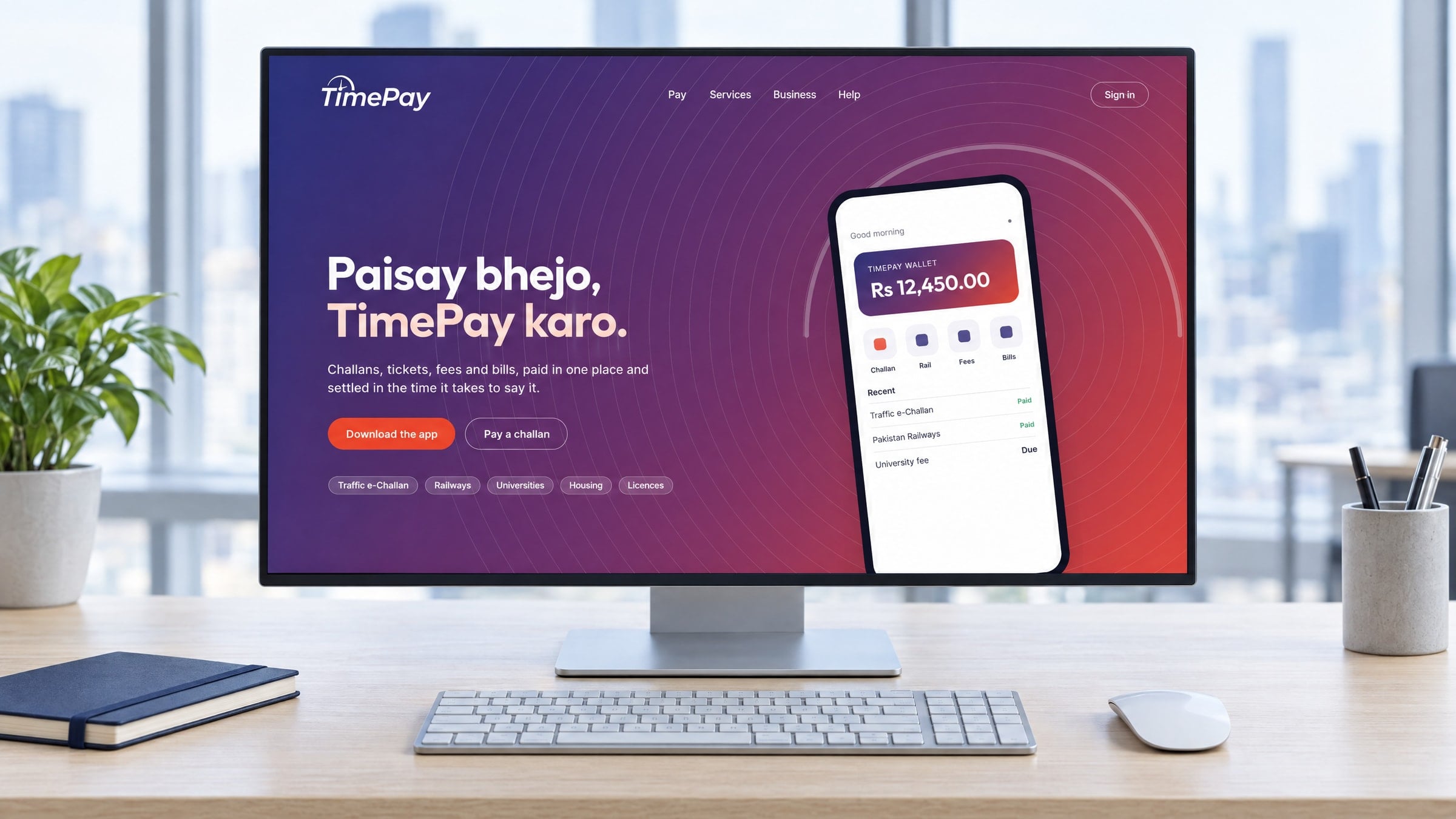 The TimePay website on a desktop display on an oak desk: the tagline in large type over the gradient, a phone showing the app beside it